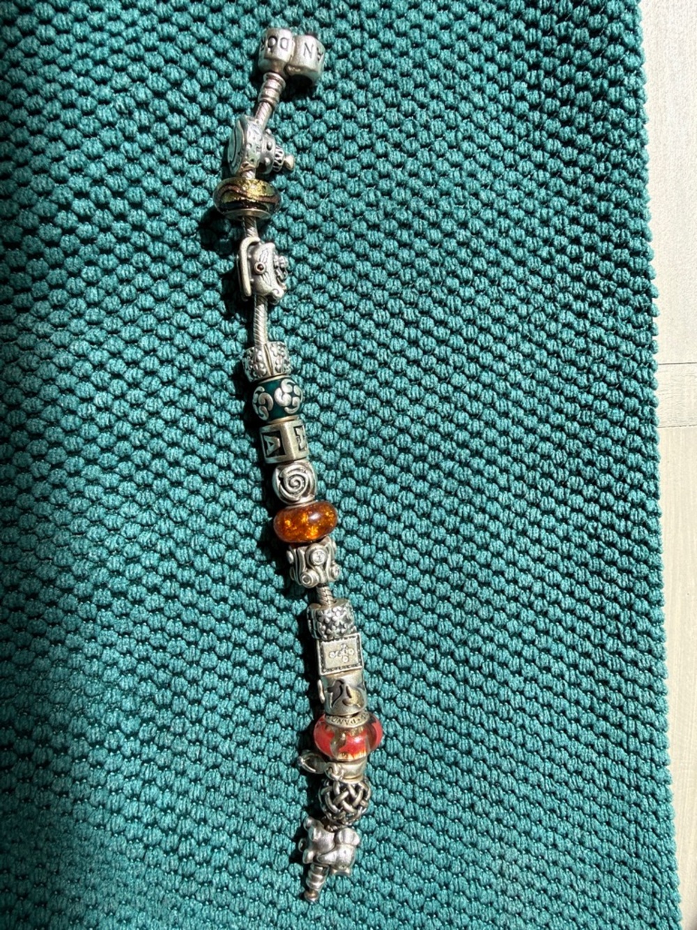 Pandora Silver Bracelet with 16 various Pandora Beads and Charms